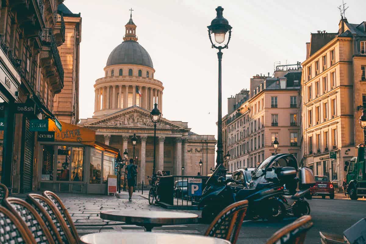 A cafe looking down an old Parisian street onto the pantheon