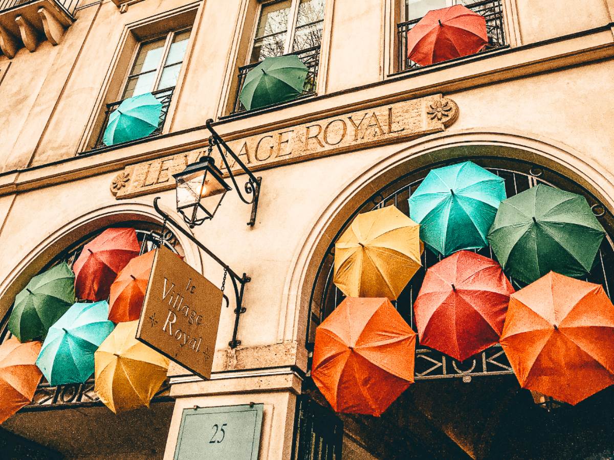 Umbrellas in the arch way at Le Village Royal, Paris