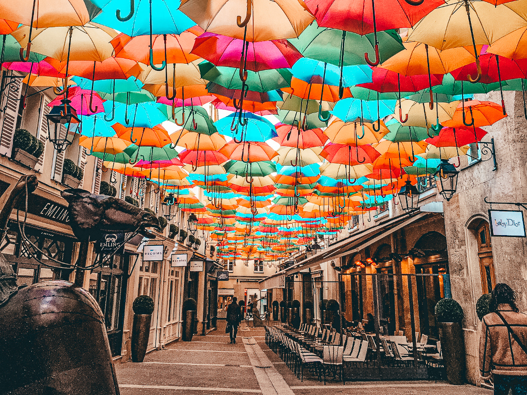 Umbrellas hanging from the roof at Le Village Royal