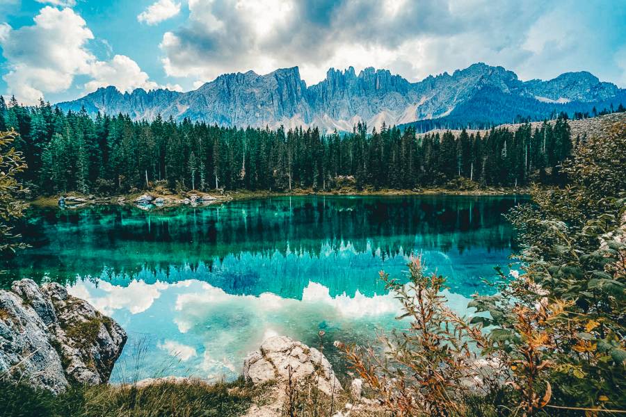 The beautiful Lago di Carezza with the mountains reflecting in the water