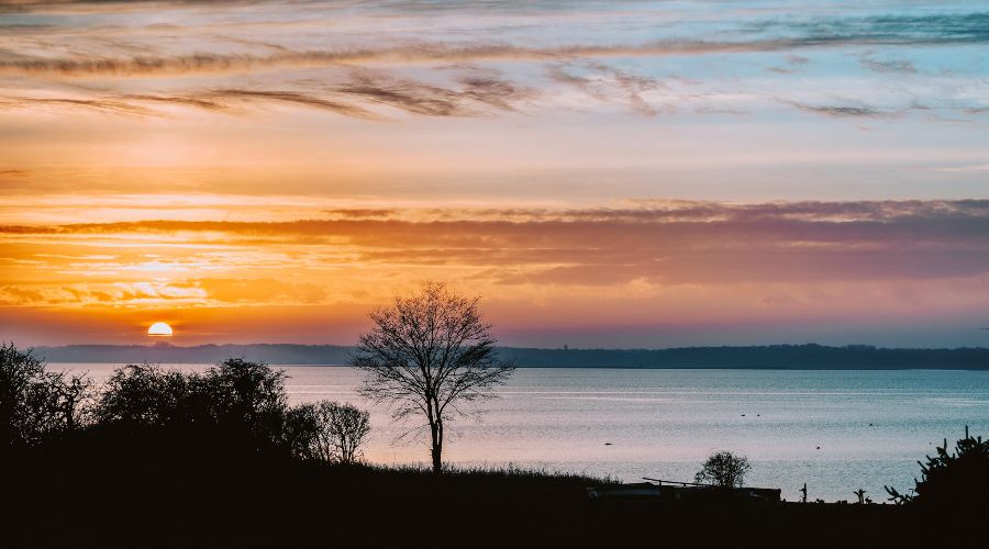 The sunsetting over the Fjord in Roskilde, Denmark