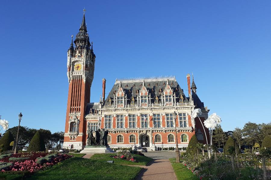 Flowers blooming in front of the Calais town in Calais, France