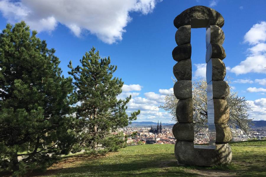 A stone structure overlooking the town of Clermont-Ferrand in France